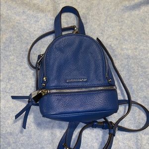 Blue Michael kors mini backpack.